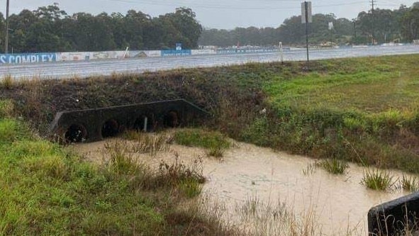 Silt-filled water from higher up in the catchment flows downstream to Woolgoolga Lake.