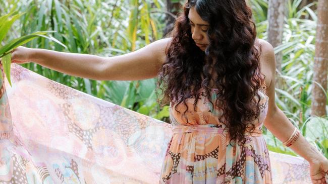 Wollongbar's Kylie Caldwell has been named a finalist in the 2023 National Indigenous Fashion Awards. Here her daughter Kyeoma Caldwell models an Evelyn Travel Scarf and Maleisha Moo Strappy Maxi Dress.