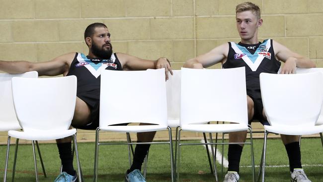 Port Adelaide Paddy Ryder and Todd Marshall wait for the team photos to start. Picture Sarah Reed 