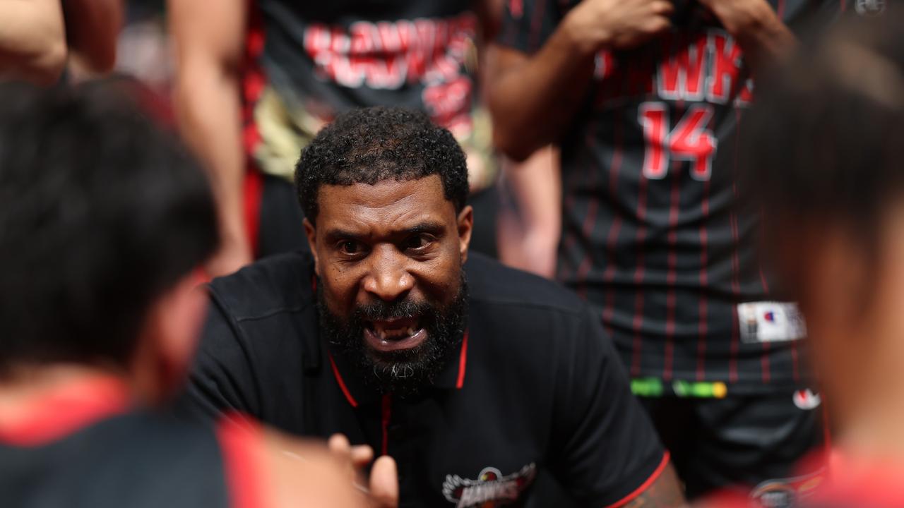 Hawks head coach Justin Tatum gives instructions to his players. Picture: Getty