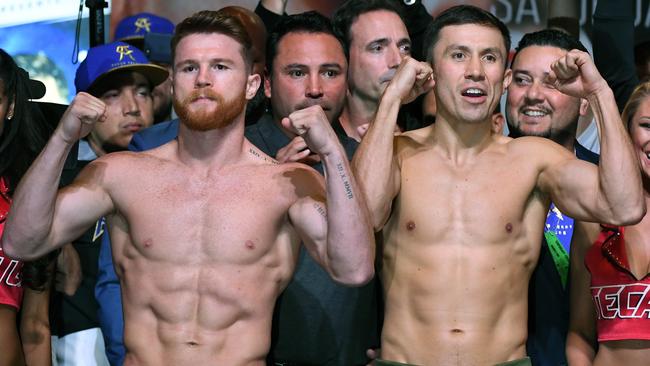 Canelo Alvarez (L) and Gennady Golovkin pose during their official weigh-in.