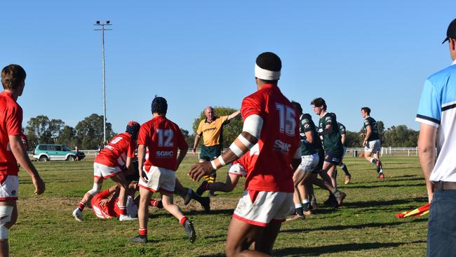 Spectators cheer on as they watch the B Grade St George vs Condamine match at the Roma Rugby Races at Bassett Park. Picture: Chloe Cufflin.