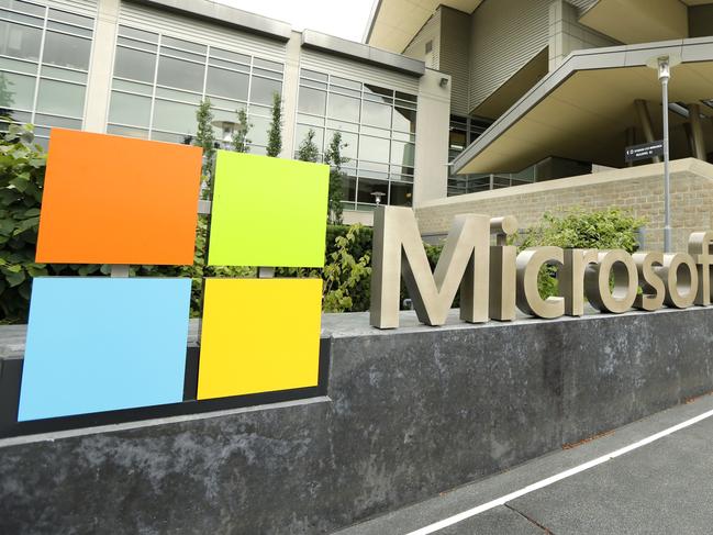 FILE - This July 3, 2014 file photo shows Microsoft Corp. signage outside the Microsoft Visitor Center in Redmond, Wash. On Wednesday, Jan. 22, 2015, Microsoft will talk about how its upcoming Windows 10 operating system will be consistent across various devices, yet familiar to those who have used past systems on PCs, as the company addresses lackluster reception for the current Windows 8. (AP Photo Ted S. Warren, File)