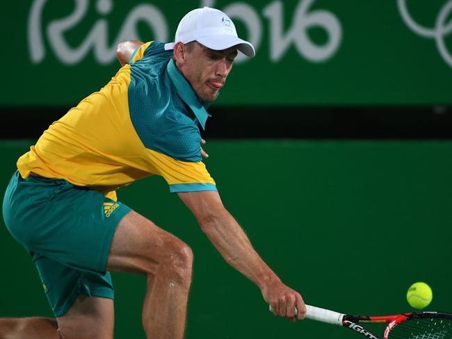 Australia's John Millman returns the ball to Japan's Kei Nishikori during their men's second round singles tennis match at the Olympic Tennis Centre of the Rio 2016 Olympic Games in Rio de Janeiro on August 8, 2016. / AFP PHOTO / Roberto SCHMIDT