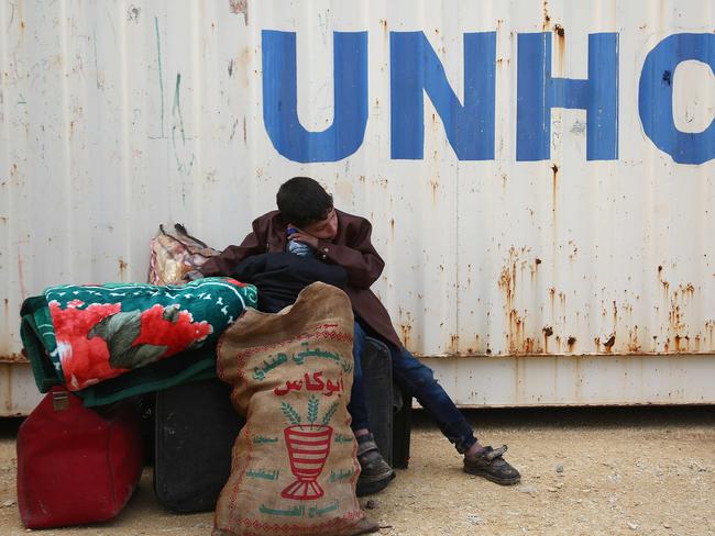 A Syrian boy sits at a camp for displaced Syrians after buses carrying Jaish al-Islam fighters and their families from their former rebel bastion of Douma arrived at the camp in al-Bal, east of the rebel-held town of Azaz in northern Syria. Picture: AFP PHOTO / Nazeer al-Khatib.