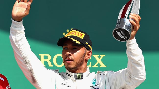 NORTHAMPTON, ENGLAND - JULY 08: Second place finisher Lewis Hamilton of Great Britain and Mercedes GP celebrates on the podium during the Formula One Grand Prix of Great Britain at Silverstone on July 8, 2018 in Northampton, England. (Photo by Mark Thompson/Getty Images)
