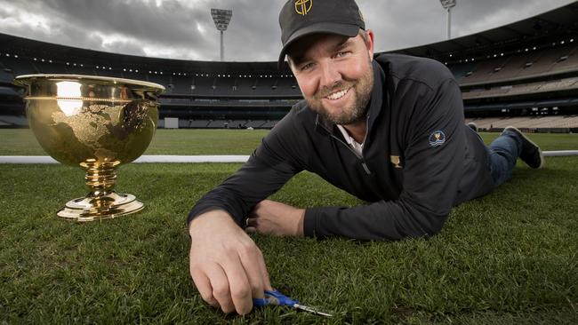 Marc Leishman gives the MCG turf a trim. Picture: Michael Klein