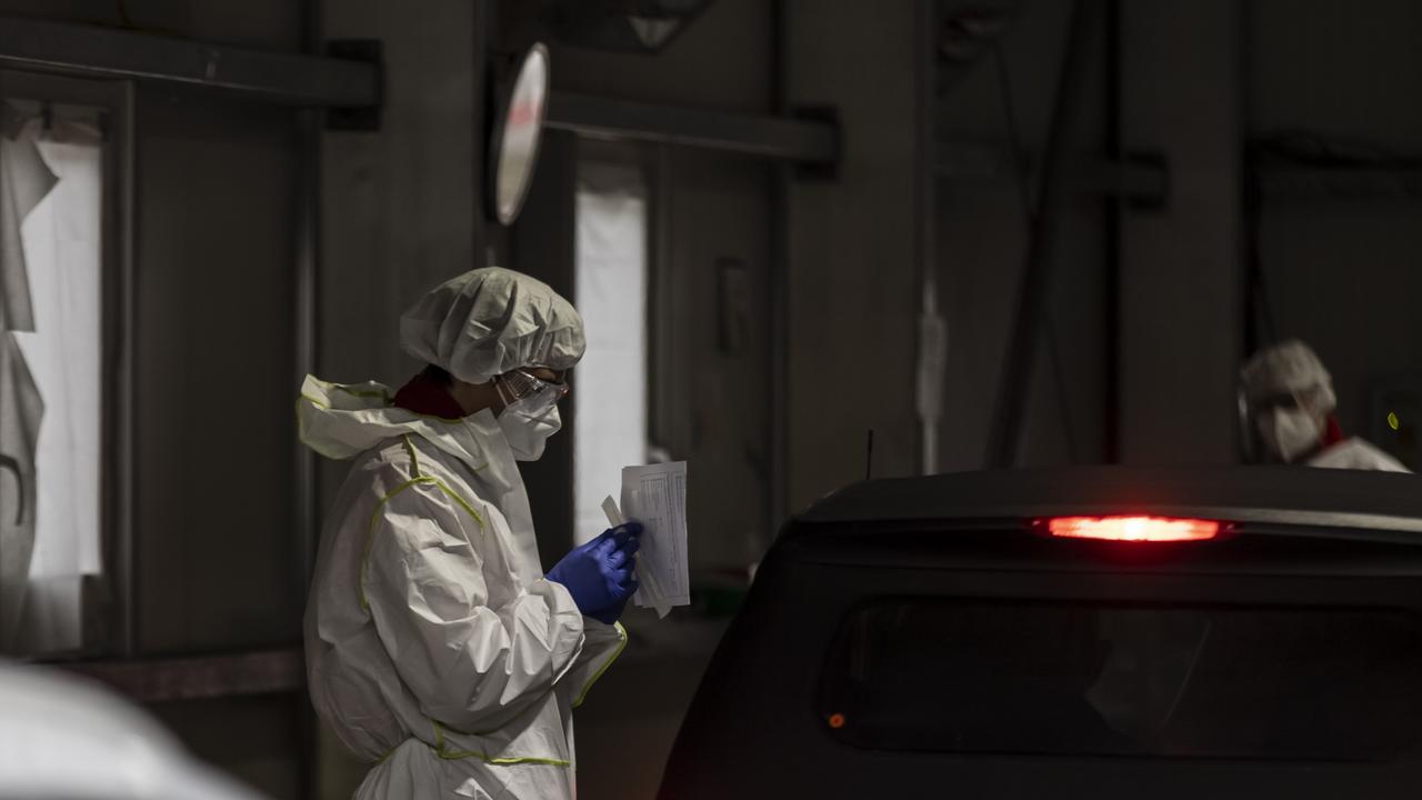 A health worker collects swab sample from a person at a COVID-19 testing station on November 08, 2021 in Innsbruck, Austria. Picture: Jan Hetfleisch/Getty Images