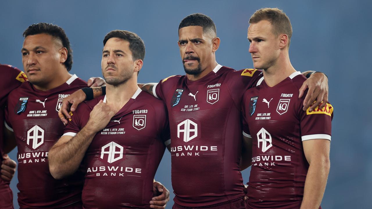 Josh Papalii, Ben Hunt, Dane Gagai and Daly Cherry-Evans of the Maroons line up for the national anthem during game one.