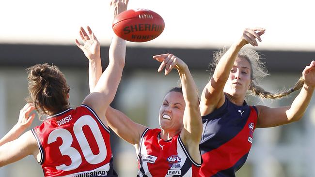 VWFL Premier Division grand final: Darebin Falcons V Diamond Creek, Darebin Falcons won 11-15-81 v 2-6-18, at Coburg City Oval, Elise O'Dea, 30, Daisy Pearce, 6, captain, Darebin Falcons , (navy shorts, red, navy, white top), & Lisa Williams, 9, Diamond Creek, (red shorts, navy, red top), Picture Yuri Kouzmin