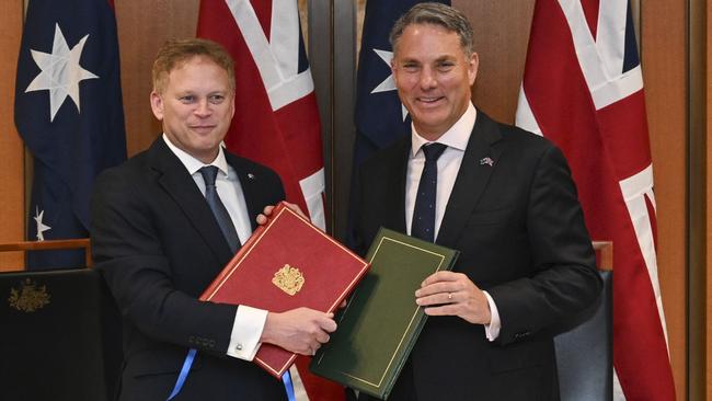 Defence Minister Richard Marles and British Defence Secretary Grant Shapps sign a new defence treaty at Parliament House in Canberra. Picture: NCA NewsWire / Martin Ollman