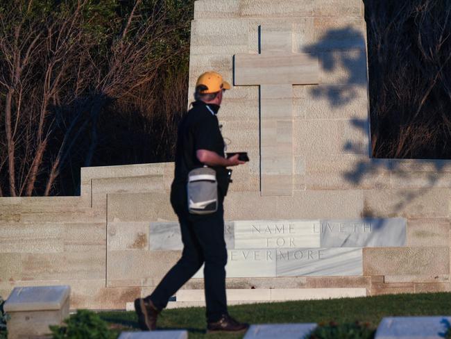 A man walks among graves at the Anzac cemetery near Anzac cove. Picture: AFP