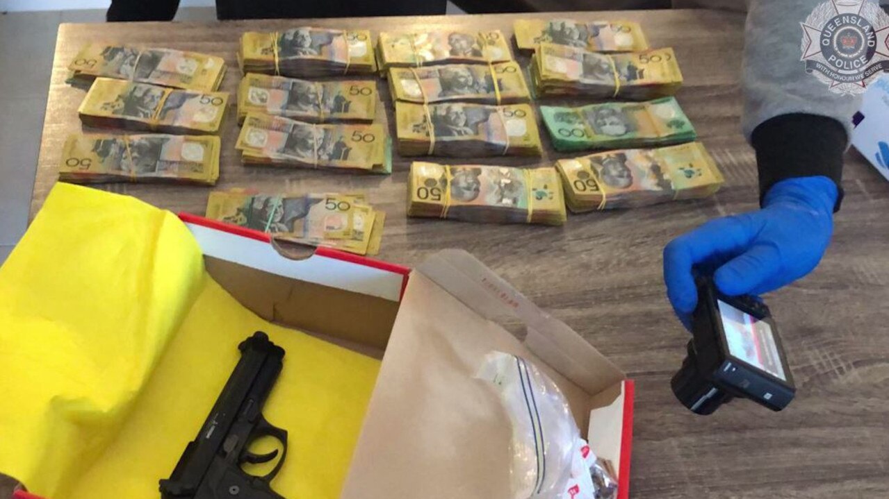 More than $40,000 and firearms were seized during the raid of a Gold Coast residence.