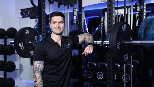 The first Air Locker Training gym in Cairns opened on September 11. Air Locker Training Cairns owner and head coach Matt Wydell puts the finishing touches to the new gym at Woree.