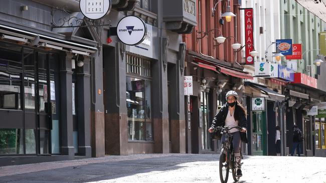 A cyclist rides down a deserted Hardware Lane in Melbourne CBD. Picture: NCA NewsWire / Ian Currie