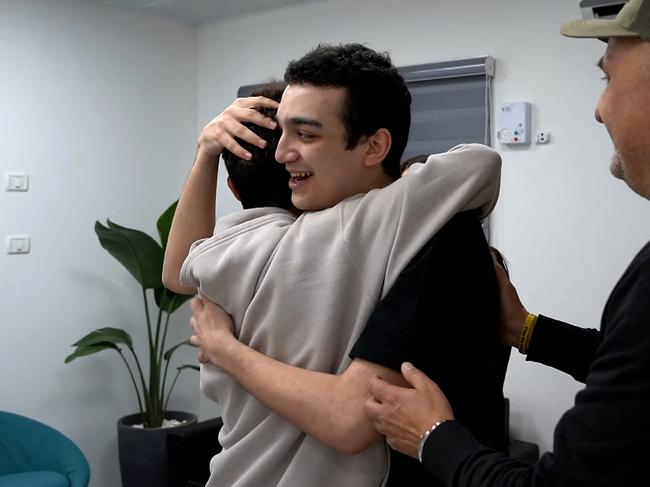 Edan Alexender with family members after his release. Picture: AFP