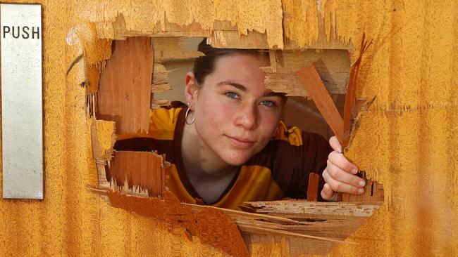 Drysdale Hawks senior womens player Caitlin Redmond with the damage cause by vandals at the club’s gym. Picture: Alison Wynd