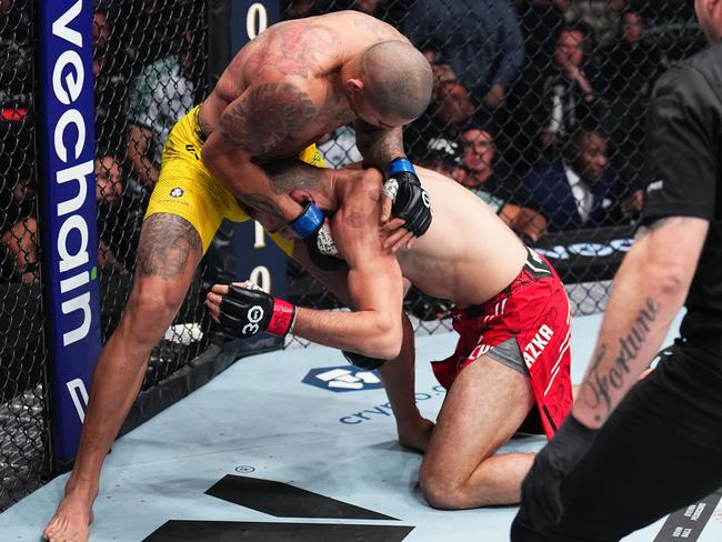 Referee Mark Goddard prepares to stop the fight. Picture: Chris Unger/Zuffa LLC via Getty Images