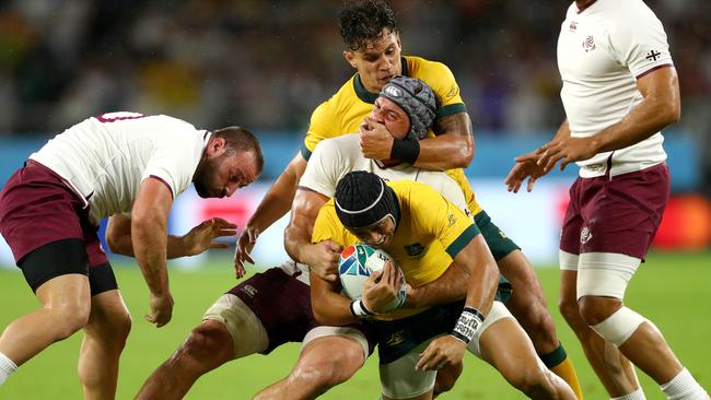 Christian Lealiifano is tackled during Australia’s clash with Georgia. Picture: Getty Images