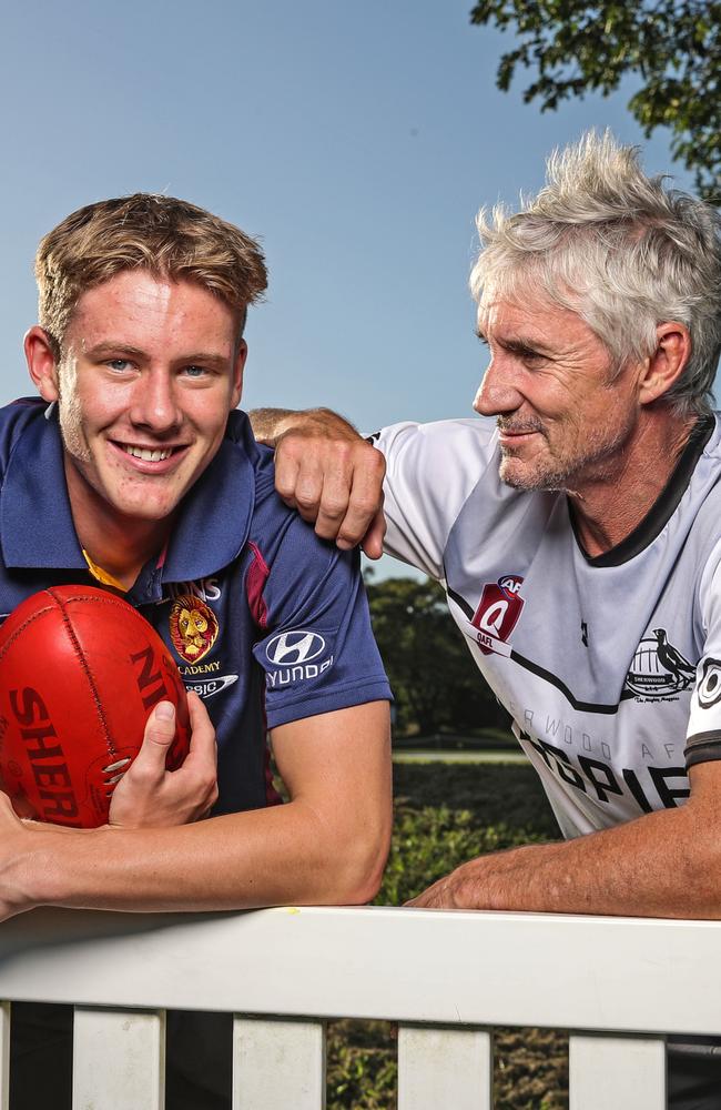 Former Lions player Adrian Fletcher alongside son Jaspa Fletcher, who attended Brisbane State High School. Picture: Zak Simmonds