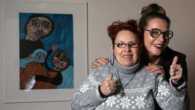 Artist Cathy Staughton celebrates her work with curator Catherine Bell.