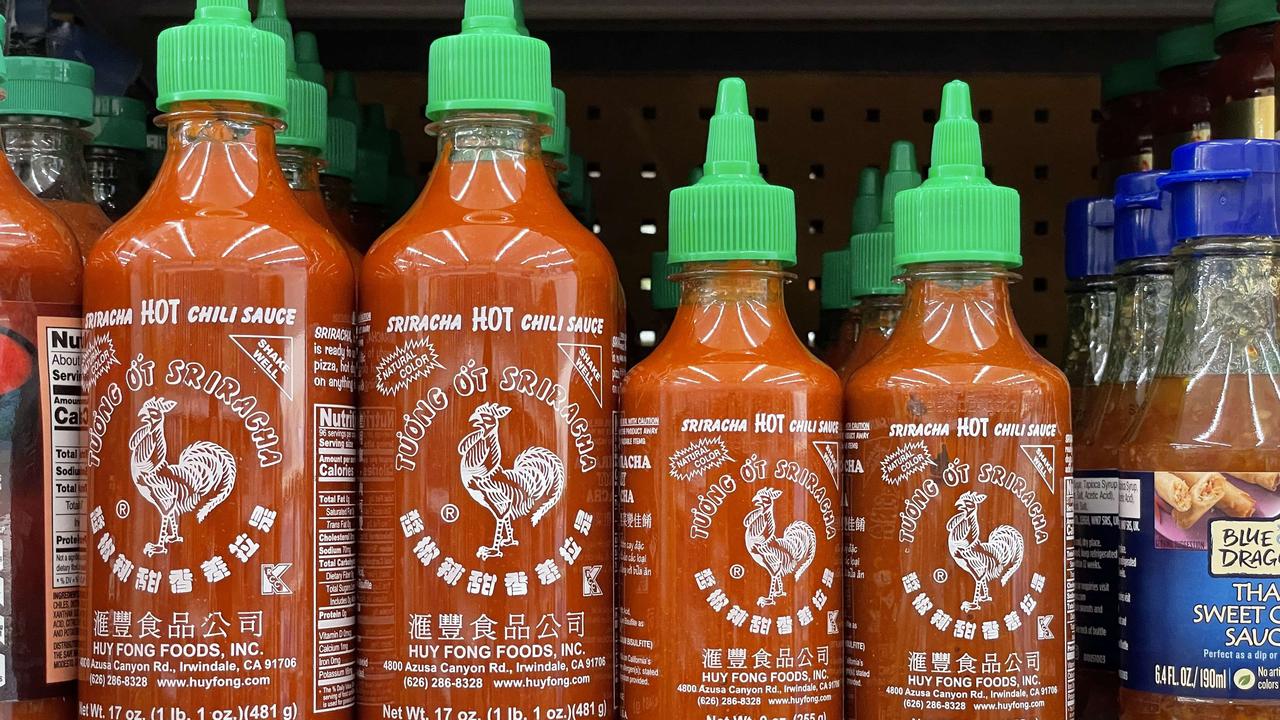 Due to a shortage of the chilli peppers used to make Sriracha hot sauce, the popular condiment is becoming hard to find on store shelves. Picture: Justin Sullivan/Getty Images/AFP