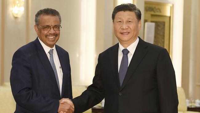 World Health Organization director general Tedros Adhanom (L) shakes hands with Chinese President Xi in Beijing in January. Picture: Naohiko Hatta/AFP