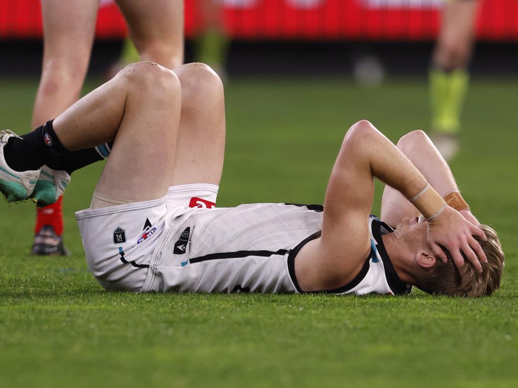 Todd Marshall collects himself after a heavy knock at the MCG. Picture: Darrian Traynor/AFL Photos/via Getty Images.