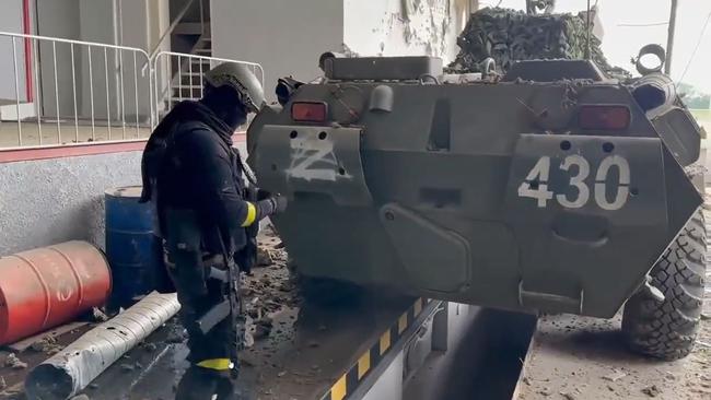 An image purportedly showing a member of either the Russian Volunteer Corps or the Free Russia Legion with a captured Russian armoured personnel carrier.