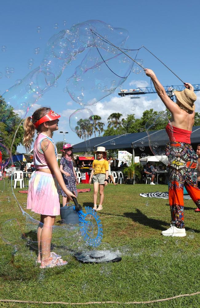 Eight-year-old Bea Berrow playing with bubbles at the 2024 Darwin International Laksa Festival on Sunday, November 3. Picture: Zizi Averill