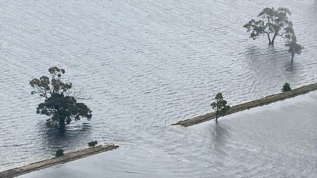 A breached levee west of Kerang has inundated 1700ha of land, which could take months to drain. Picture: Supplied