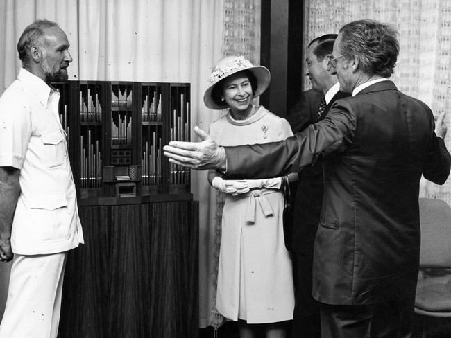 The Queen views a 1/10th scale model of new Silver Jubilee Organ instrument for the Adelaide Festival Centre's theatre, with Adelaide Festival Centre Trust director Anthony Steel, chairman David Wynn and Lord Mayor of Adelaide John Roche.