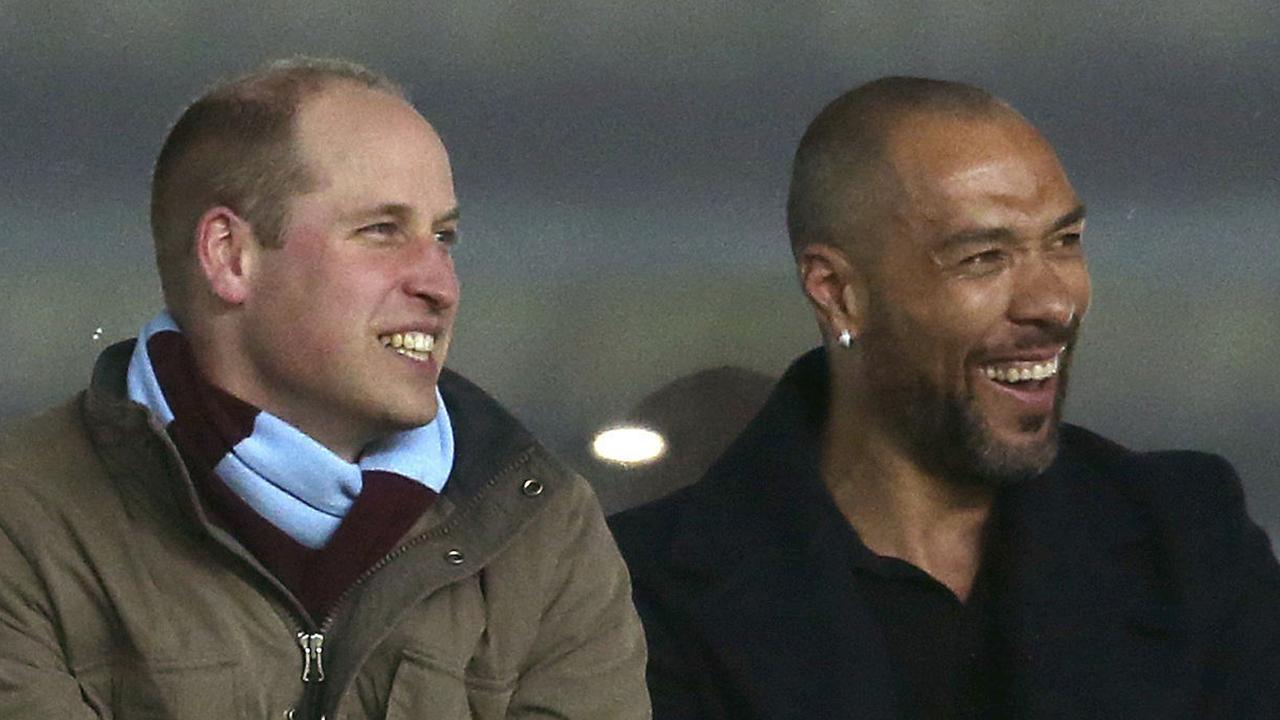 Britain's Prince William and former Norwegian international soccer player John Carew watch in an executive box.
