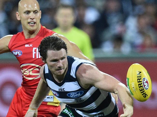 Patrick Dangerfield (right) of the Cats and Gary Ablett of the Suns contest during the round 6 AFL match between the Geelong Cats and the Gold Coast Suns at Simonds Stadium in Geelong, Saturday, April 30, 2016. (AAP Image/Julian Smith) NO ARCHIVING, EDITORIAL USE ONLY