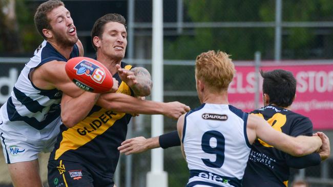 SANFL: Glenelg v South Adelaide at Glenelg Oval, Saturday, April 13, 2019. Michael Knoll spoils Glenelg's Jesse White. (AAP Image/Brenton Edwards),