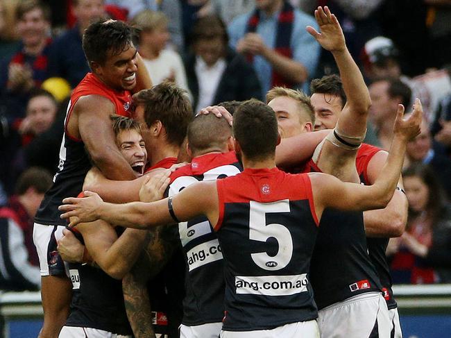 Round 9: Richmond v Melbourne MCG. Demon's players celebrate the win as Brett Delidio looks on. May 17th 2014. Picture : Colleen Petch