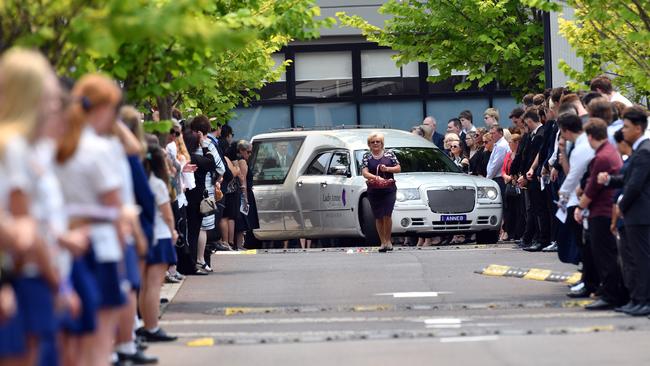 Mourners form a guard of honour. Picture: Sam Mooy