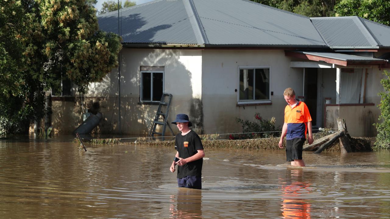 Inglewood residents return to their properties to inspect the damage after the towns was hit by major flooding. Picture: Lachie Millard