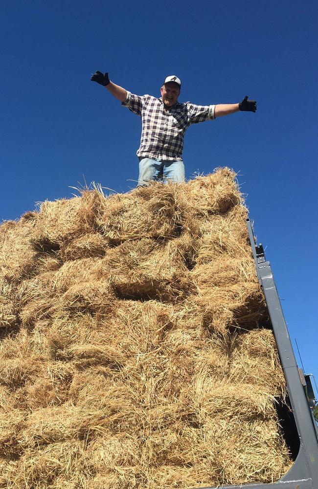 Paul Aitken with some of the hay to be trucked to the mainland.