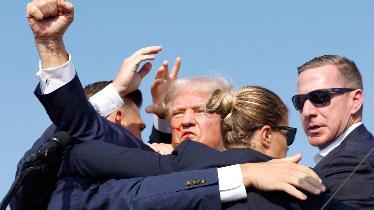 Mr Trump raises a defiant fist to the crowd after the first attempt on his life in Butler, Pennsylvania. Picture: Anna Moneymaker/Getty Images via AFP