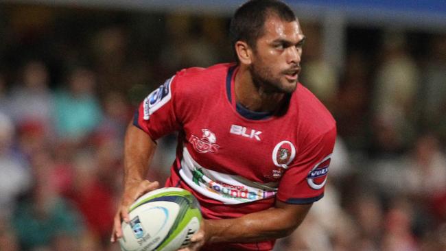 Karmichael Hunt looks for a Reds teammate.