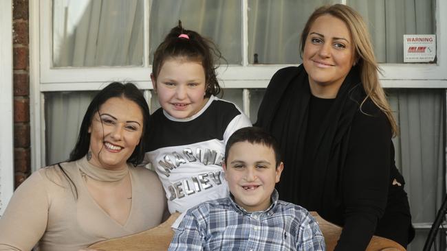 Andreas Vavaris, 14, with his sister Christie, 9, Renee Gipp, and mum Angela. Picture: Valeriu Campan