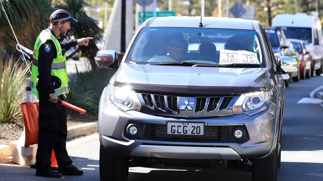 Police checking vehicles at a border checkpoint on Griffith Street at Coolangatta. Picture: Adam Head