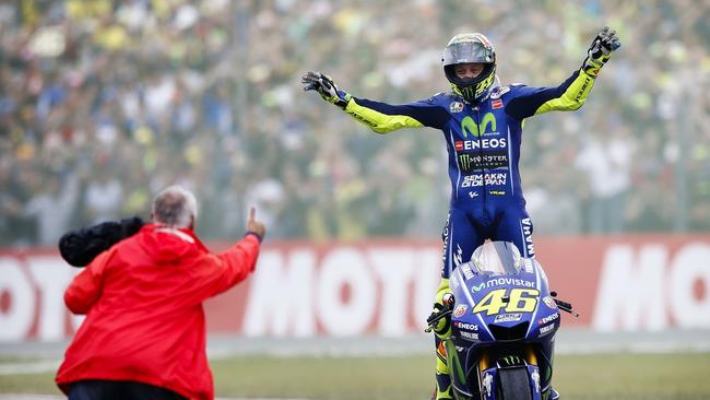 TOPSHOT - Italy's Valentino Rossi celebrates after winning the Assen Motorcycling Grand Prix at the TT circuit in Assenon on June 25, 2017.  / AFP PHOTO / ANP / Vincent Jannink / Netherlands OUT