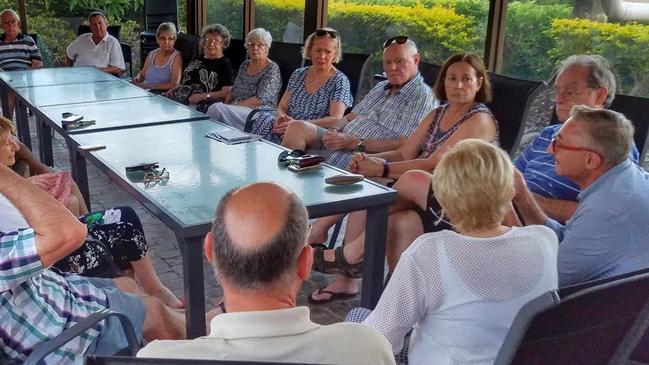 Eddy Sarroff (far right) talking to Southport residents about their protest against a second Gold Coast casino.