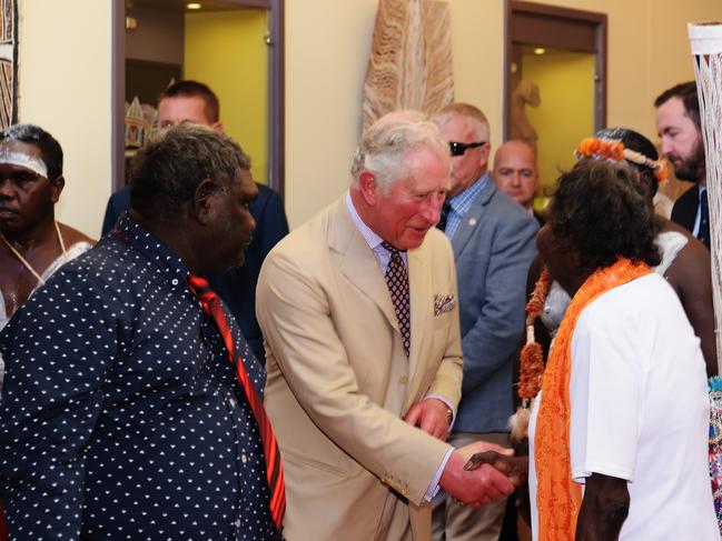 Charles, Prince of Wales greets a local at the Buku-Larrnggay Mulka Centre. Picture: Keri Megelus