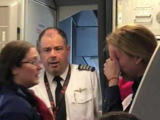 The video shows the sobbing mum asking to have her pushchair back after it was allegedly taken from her by crew. Picture: Facebook.