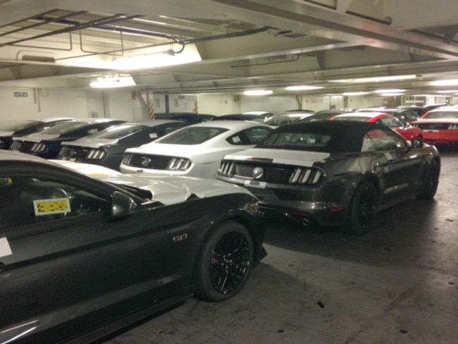 Ready and waiting ... 2015 Ford Mustangs waiting to be unloaded at port in Melbourne. Picture: Supplied