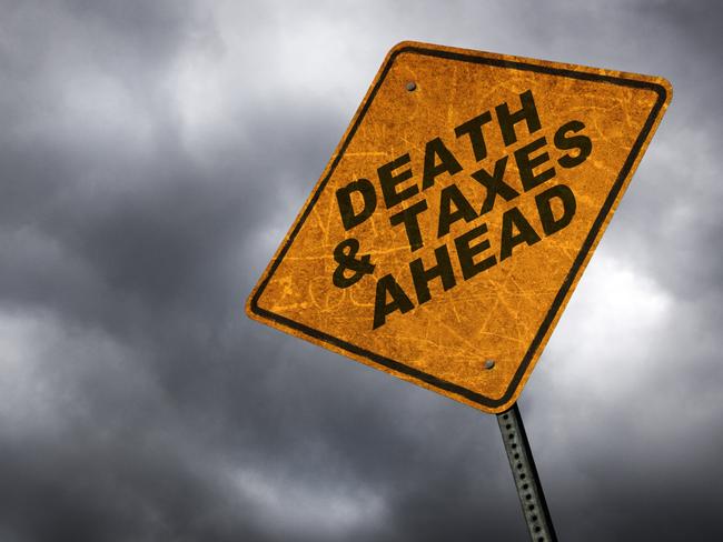 A road sign warning of the inevitability of death & taxes. inheritance tax generic