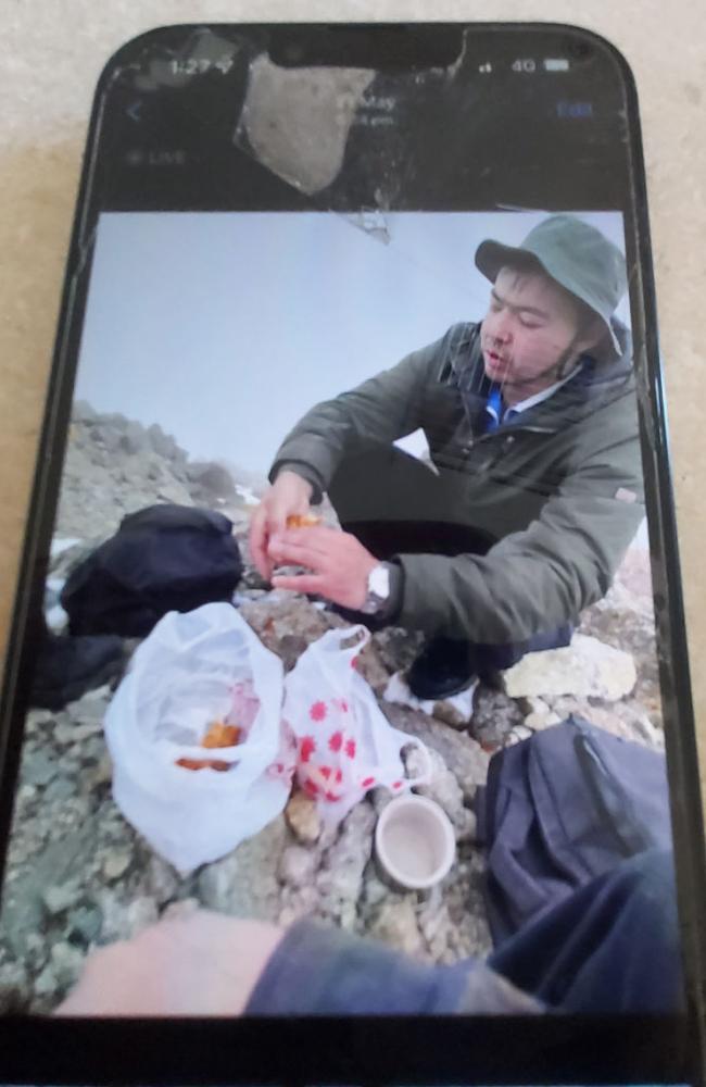 A picture on Mr Herd’s smashed phone that shows a man Ms Costa believes was sharing lunch with her son during the hike. Ms Costa hopes the man will be able to shed more light on her son’s behaviour prior to his death. Picture: Supplied